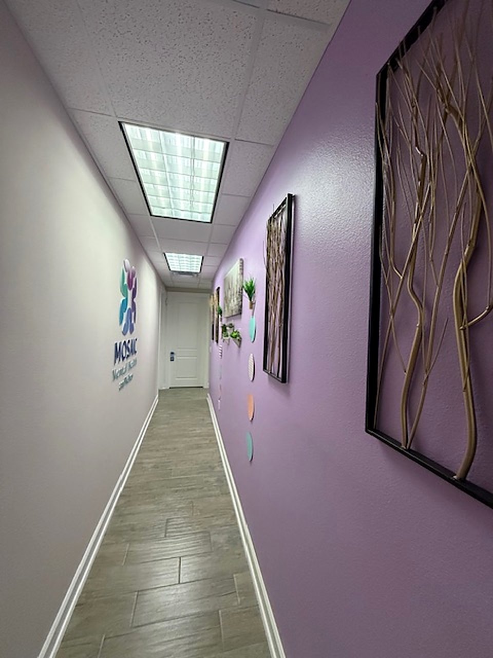 The hallway to the consultation rooms, with the Mosaic mark