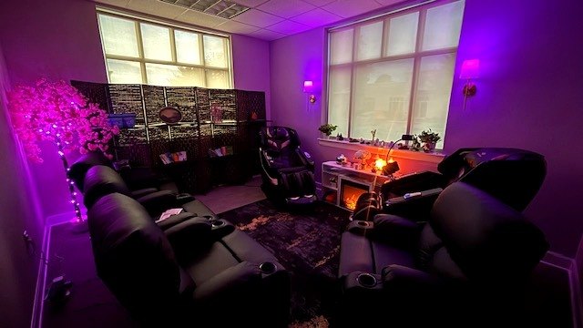The Relaxation Room in evening light, with the blossom tree and the woven screen